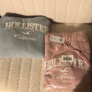 Hollister hoodie, blue and pink both size medium. Both have tags